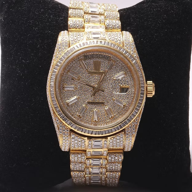 Gold watch with diamond accents on a black background