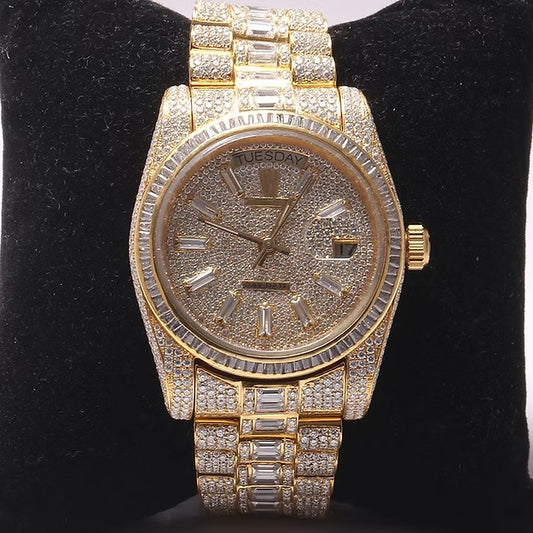 Gold watch with diamond accents on a black background