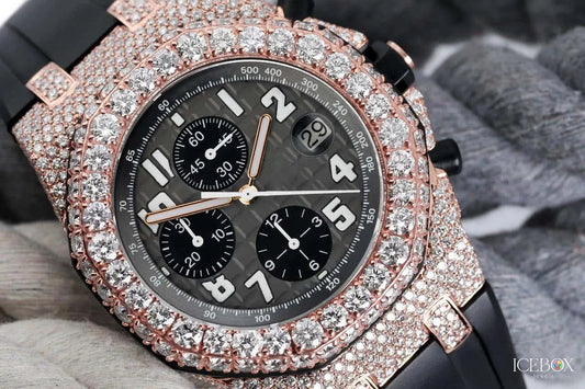 Luxury watch with rose gold case and black dial on a textured surface